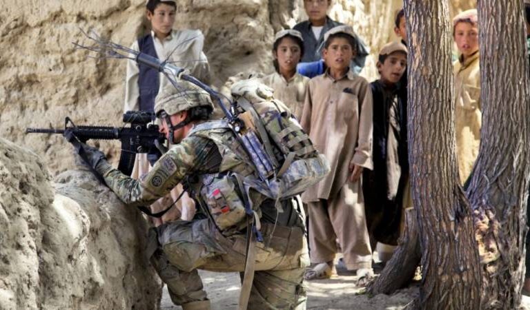 U.S. Army Pvt. Zakery Jenkins, front, with Charlie Troop, 3rd Squadron, 73rd Cavalry Regiment, 1st Brigade Combat Team, 82nd Airborne Division, provides security in Mush Kahel village, Ghazni province, Afghanistan, July 23, 2012. (U.S. Army photo by Spc. Andrew Baker/Released)