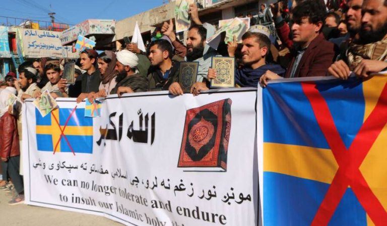 Protesters hold a banner during a demonstration against the burning of the Koran by Swedish-Danish far-right politician Rasmus Paludan, in Khost on January 24, 2023. - Hundreds of Afghan men staged a protest in the eastern city of Khost on January 24 to express anger at the burning of the Koran in the Swedish capital over the weekend. (Photo by AFP) (Photo by -/AFP via Getty Images)