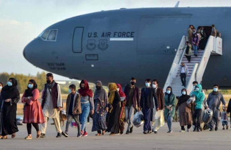 Refugees disembark from a US air force aircraft after an evacuation flight from Kabul at the Rota naval base in Rota, southern Spain, on August 31, 2021. - Spain has agreed to host up to 4,000 Afghans who will be airlifted by the United States to airbases in Rota and Moron de la Frontera in southern Spain. (Photo by CRISTINA QUICLER / AFP) (Photo by CRISTINA QUICLER/AFP via Getty Images)
