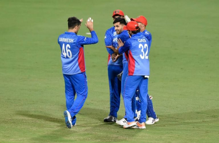 BRISBANE, AUSTRALIA - OCTOBER 17: Fazalhaq Farooqi of Afghanistan celebrates a wicket during the ICC 2022 Men's T20 World Cup Warm Up Match between Afghanistan and Bangladesh at Allan Border Field on October 17, 2022 in Brisbane, Australia. (Photo by Matt Roberts-ICC/ICC via Getty Images)