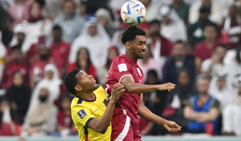 Ecuador's midfielder #19 Gonzalo Plata (L) and Qatar's defender #14 Homam Ahmed fight for the ball during the Qatar 2022 World Cup Group A football match between Qatar and Ecuador at the Al-Bayt Stadium in Al Khor, north of Doha on November 20, 2022. (Photo by Glyn KIRK / AFP)