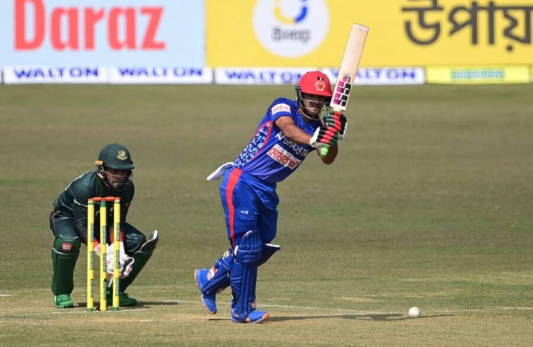 Afghanistan's Najibullah Zadran (R) plays a shot during the first one-day international (ODI) cricket match between Afghanistan and Bangladesh at the Zahur Ahmed Chowdhury Stadium in Chittagong on February 23, 2022. (Photo by Munir uz ZAMAN / AFP) (Photo by MUNIR UZ ZAMAN/AFP via Getty Images)