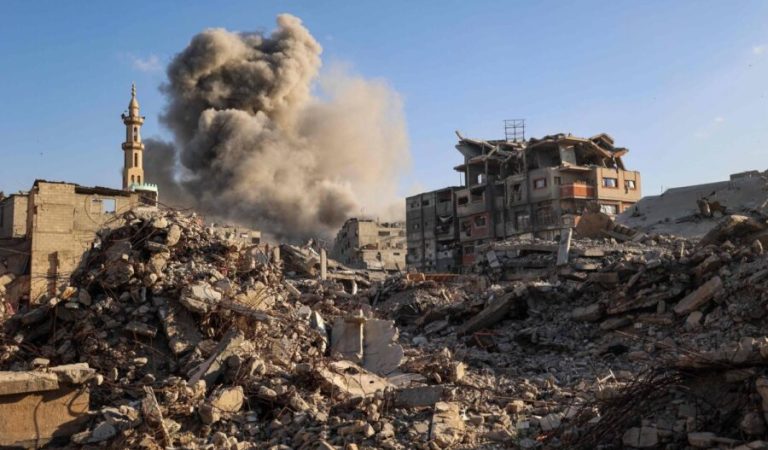 Smoke billows following an Israeli strike that targeted a building in the Bureij camp for Palestinian refugees in the central Gaza Strip on October 19, 2025. Gaza's civil defence agency said a series of Israeli air strikes on October 19 killed at least 11 people across the territory, as Israel and Hamas traded blame for violating a ceasefire. (Photo by Eyad BABA / AFP)