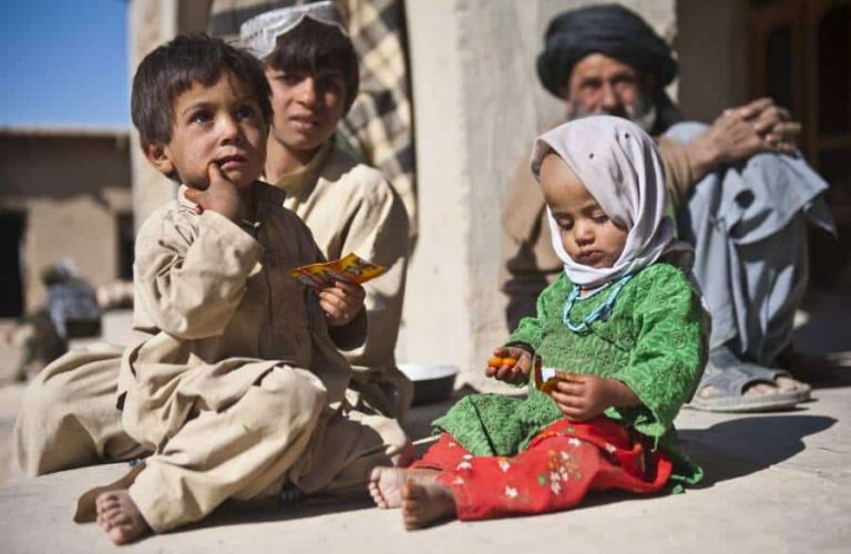 Afghan children enjoy American candy given to them by a U.S. Army Soldier with Special Operations Task Force - South, Nov. 27, 2010, in Maiwand District, Kandahar Province, Afghanistan. (U.S. Army photo by Spc. Daniel P. Shook / Special Operations Task Force - South)(Released)