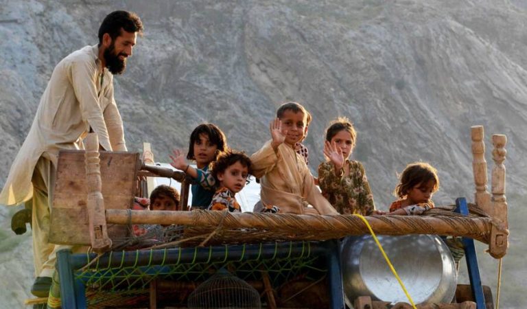 In this photograph taken on September 7, 2016, a repatriated Afghan refugee family travel on a loaded vehicle as they prepare to cross the border into Afghanistan, at the Torkham crossing point in Pakistan's tribal Khyber district.
Pakistan has provided safe haven for decades for millions like Mohammad Anwar, who fled Afghanistan along with his parents and other family members when he was just seven years old, after the Soviet invasion of 1979. But as war against the Soviets morphed into civil war, Taliban rule, the US invasion and the grinding conflict against insurgents in Afghanistan today, even Pakistan's famed hospitality has run out. / AFP PHOTO / A MAJEED / TO GO WITH Pakistan-Afghanistan-UNHCR-refugees-politics,FOCUS by Sajjad Tarakzai with Anne Chaon