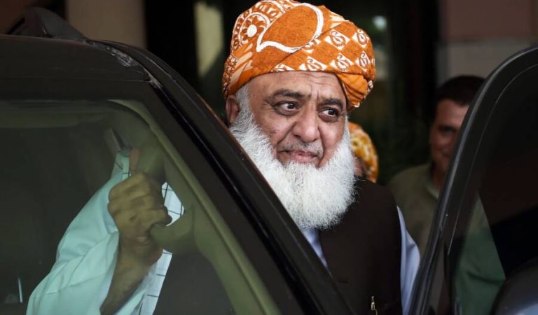 Pakistani opposition leader and head of Muttahida Majlis-e-Amal (MMA), a religious parties alliance, Maulana Fazalur Rehman leaves after attending a meeting in Islamabad on July 31, 2018.
A group of Pakistani political parties announced a protest demanding new elections following allegations of rigging in last week's nationwide polls that were won by cricket hero Imran Khan's party. "We will run a movement for holding of elections again. There will be protests," said Maulana Fazalur Rehman from the All Parties Conference, which included outgoing ruling party, the Pakistan Muslim League-Nawaz / AFP PHOTO / AAMIR QURESHI