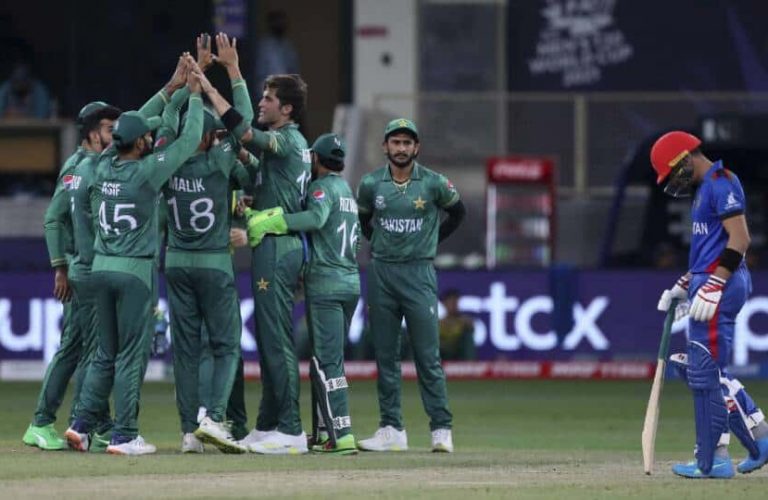 Pakistan's Shaheen Afridi, center without cap, celebrates with teammates the dismissal of Afghanistan's Mohammad Shahzad during the Cricket Twenty20 World Cup match between Pakistan and Afghanistan in Dubai, UAE, Friday, Oct. 29, 2021. (AP Photo/Aijaz Rahi)