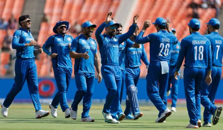 AHMEDABAD, INDIA - FEBRUARY 11: Rashid Khan of Afghanistan celerates with Sediqullah Atal of Afghanistan after the wicket of Aiden Markram of South Africa during the ICC Men's T20 World Cup India & Sri Lanka 2026 match between South Africa and Afghanistan at Narendra Modi Stadium on February 11, 2026 in Ahmedabad, India. (Photo by Surjeet Yadav-ICC/ICC via Getty Images)