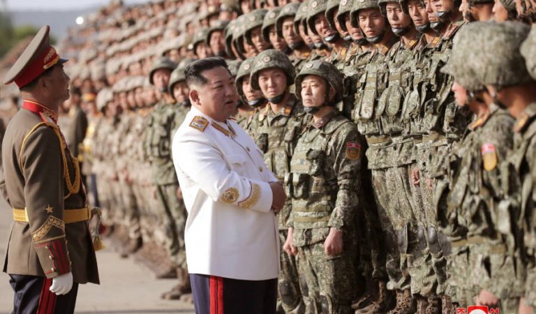 North Korean leader Kim Jong Un meets troops who have taken part in the military parade to mark the 90th anniversary of the founding of the Korean People's Revolutionary Army, in this undated photo released by North Korea's Korean Central News Agency (KCNA) April 29, 2022. KCNA via REUTERS