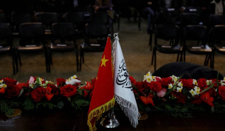 FILE PHOTO: The flags of the China and the Islamic Emirate of Afghanistan are displayed during a news conference held by Afghan Deputy Prime Minister Mullah Abdul Ghani Baradar and Wang Yu, China's ambassador in Afghanistan, in Kabul, Afghanistan, January 5, 2023. REUTERS/Ali Khara/File Photo