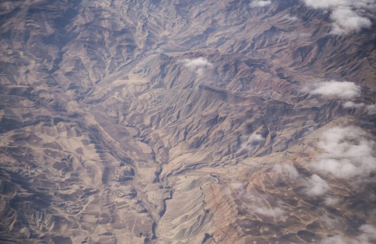 Flying into Qala i Naw, the capital of Badghis Province, which is badly affected by a drought that struck northern Afghanistan in 2017 and continues through to the present. More Afghans have been displaced by drought this year than by conflict, and Qala i Naw is its epicentre. Now, at the start of winter, many displaced farming families say they should have been planting their winter wheat crops but have no seeds to plant, having been forced to eat them. The same families will therefore not have a crop to harvest in spring. 60% of the province's livestock are also believed to have succumbed to the drought.