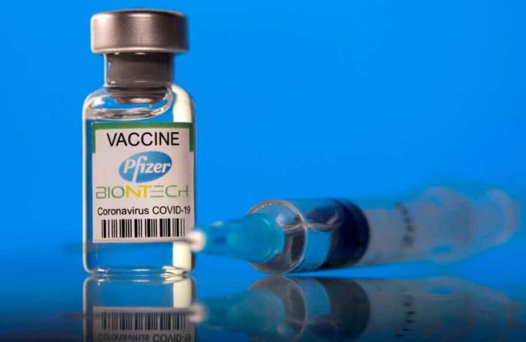 FILE PHOTO: A vial labelled with the Pfizer-BioNTech coronavirus disease (COVID-19) vaccine is seen in this illustration picture taken March 19, 2021. REUTERS/Dado Ruvic/Illustration