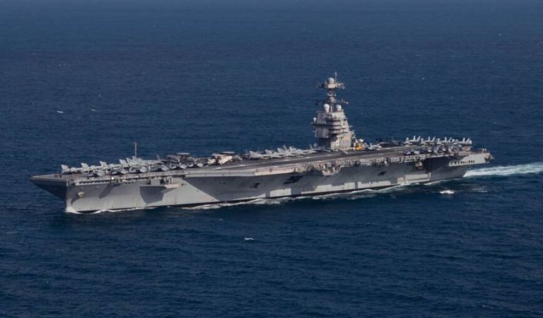 221009-N-TL968-1248 ATLANTIC OCEAN (Oct. 9, 2022) The first-in-class aircraft carrier USS Gerald R. Ford (CVN 78) steams the Atlantic Ocean during a simulated straits transit with the Gerald R. Ford Carrier Strike Group (GRFCSG) in the Atlantic Ocean, Oct. 9, 2022. The Gerald R. Ford Carrier Strike Group is deployed in the Atlantic Ocean, conducting training and operations alongside NATO Allies and partners to enhance integration for future operations and demonstrate the U.S. Navy's commitment to a peaceful, stable and conflict-free Atlantic region. (U.S. Navy photo by Mass Communication Specialist 2nd Class Jackson Adkins)