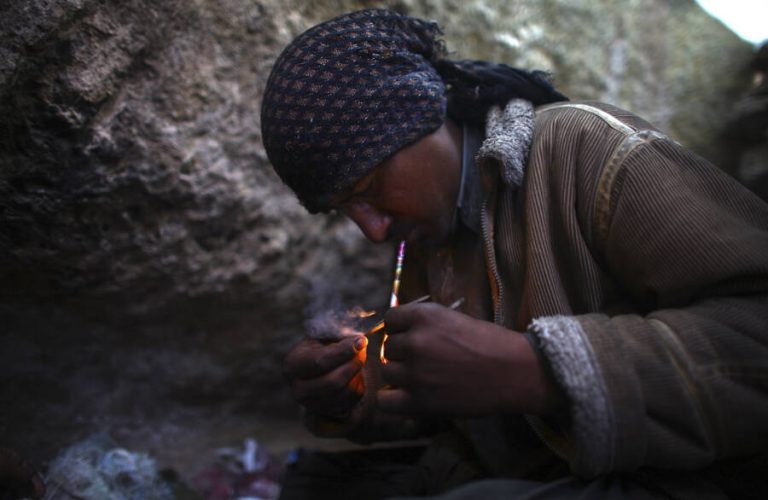Ahmad, who wouldn't give his last name, smokes heroin. He lives in a makeshift village filled with drug addicts called Kamar Kulagh, on the outskirts of the western Afghan city of Herat.