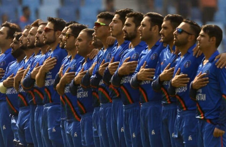Afghanistan players line up for the national anthems before the start of the one day international (ODI) Asia Cup cricket match between Afghanistan and India at the Dubai International Cricket Stadium in Dubai on September 25, 2018. (Photo by ISHARA S. KODIKARA / AFP)        (Photo credit should read ISHARA S. KODIKARA/AFP/Getty Images)