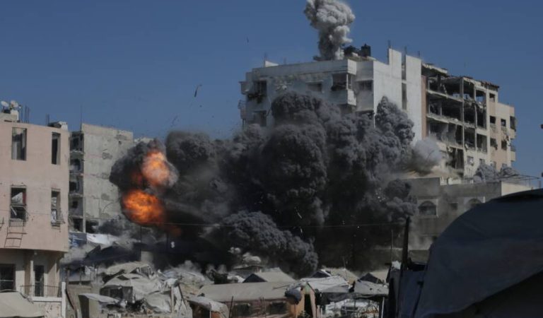 Smoke and flames rise after an Israeli military strike on a building in Gaza City, Friday, Sept. 12, 2025. (AP Photo/Yousef Al Zanoun)
