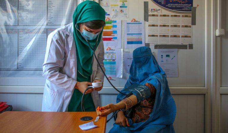 A doctor measures the blood pressure of a patient at the Kahdistan health clinic in Herat province, Afghanistan, on Oct. 7. The increasing presence of midwives across the country has started to play a role in improving a mother’s and baby’s chances of survival. Afghanistan’s maternal mortality rate has dropped from 1,300 deaths per 100,000 live births in 2002 to 638 deaths per 100,000 births in 2017. Lynzy Billing for Foreign Policy