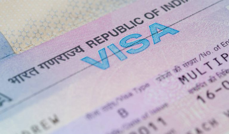 A closeup of an Indian business visa vignette inside a passport.  Shallow DoF with focus on the word "VISA". (A closeup of an Indian business visa vignette inside a passport.  Shallow DoF with focus on the word "VISA"., ASCII, 109 components, 109 byte