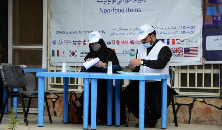 United Nations High Commissioner for Refugees (UNHCR) workers prepare to distribute non-food items to women at UNHCR office in Kandahar on March 8, 2022. (Photo by Javed TANVEER / AFP) (Photo by JAVED TANVEER/AFP via Getty Images)