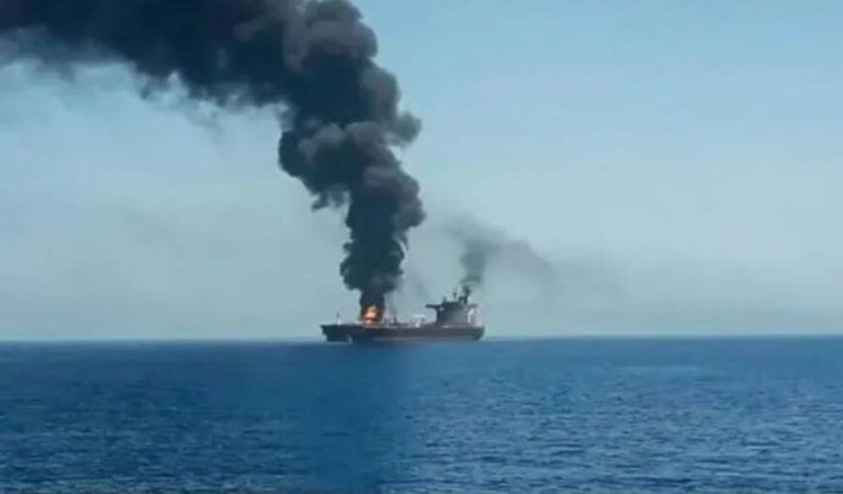 A supertanker catches fire in the Strait of Hormuz