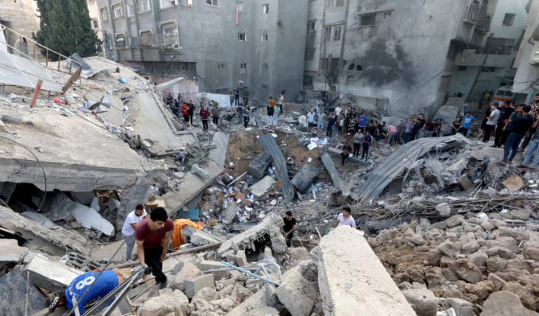 TOPSHOT - Palestinians search the destroyed annex of the Greek Orthodox Saint Porphyrius Church, the oldest church still in use in Gaza, damaged in a strike on Gaza City on October 20, 2023, amid the ongoing battles between Israel and the Palestinian group Hamas. Thousands of people, both Israeli and Palestinians have died since October 7, 2023, after Palestinian Hamas militants based in the Gaza Strip, entered southern Israel in a surprise attack leading Israel to declare war on Hamas in Gaza on October 8. (Photo by Dawood NEMER / AFP) (Photo by DAWOOD NEMER/AFP via Getty Images)