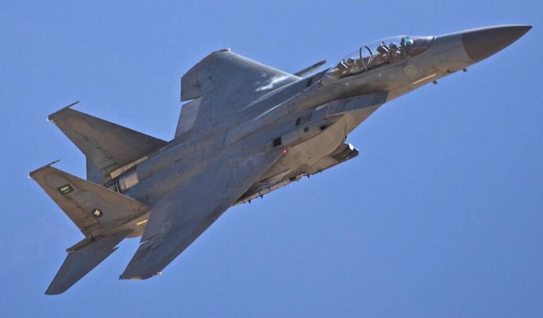 A Royal Saudi Air Force F-15 flies over the training lanes, demonstrating their ability to provide air support by dropping flares as simulated bombs during Friendship Two.