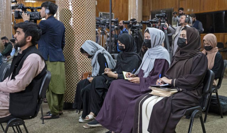 Afghan female journalists wearing facemasks, attend a press conference by Afghanistan's Minister of Foreign Affairs Amir Khan Muttaqi, in Kabul on September 19, 2024. (Photo by Wakil KOHSAR / AFP)