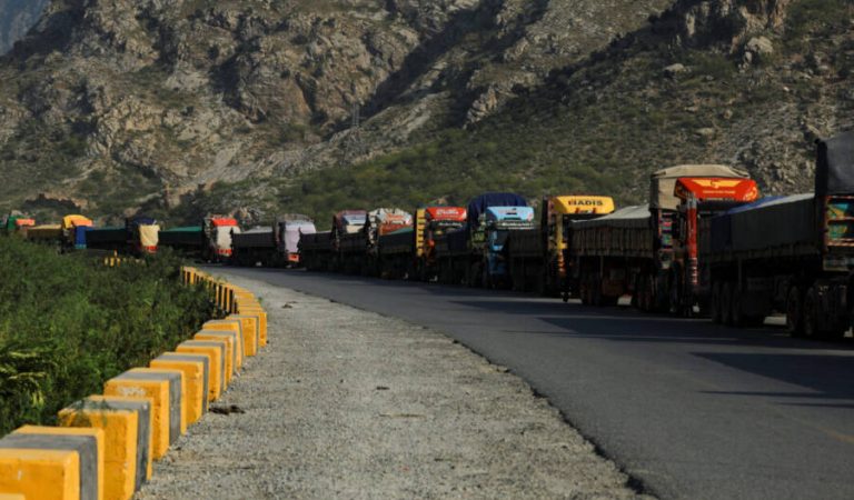 Trucks loaded with supplies park along a road leading to the Torkham border, after Pakistan closed border crossings with Afghanistan, following exchanges of fire between the two nations' forces, in Torkham, Pakistan, October 15, 2025. REUTERS/Fayaz Aziz