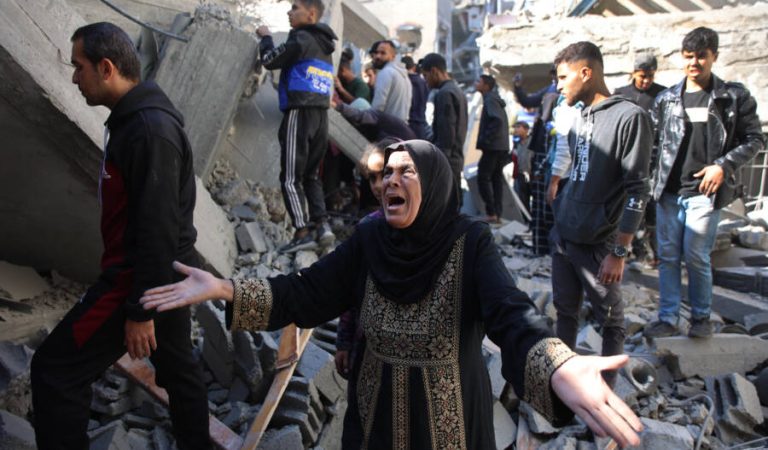 A Palestinian woman reacts as she stands amid the rubble of a building destroyed in an Israeli strike on the Shujaiyah neighbourhood in Gaza City in the northern Gaza Strip on November 30, 2024, during the ongoing war between Israel and the Hamas militant group. (Photo by Omar AL-QATTAA / AFP)