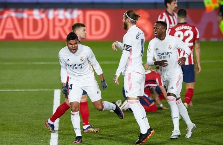 Casemiro of Real Madrid celebrates after scoring the 1-0 with his teammate Sergio Ramos and Vinicius Junior during the La Liga match between Real Madrid and Atletico de Madrid played at Alfredo Di Stefano Stadium on December 12, 2020 in Madrid, Spain. (Photo by Ruben Albarran/Pressinphoto/Icon Sport via Getty Images)