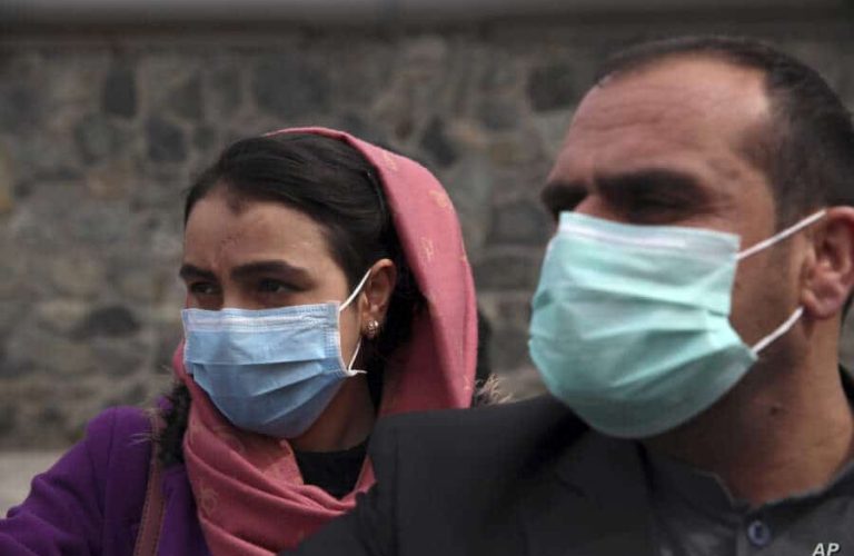 Afghan journalists wear face masks during a coverage of a campaign to raise awareness of the new coronavirus in Kabul, Afghanistan, Monday, March 16, 2020. For most people, the new coronavirus causes only mild or moderate symptoms. For some it can cause more severe illness. (AP Photo/Rahmat Gul)