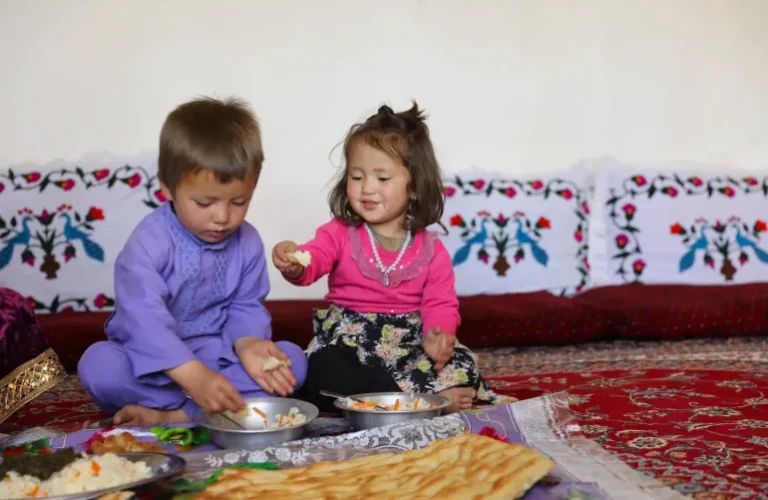 Afghan children eating.