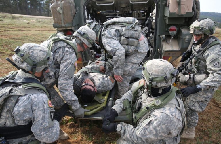 U.S. Soldiers assigned to Bravo Troop, 1st Squadron, 2nd Cavalry Division prepare to medically evacuate a simulated wounded Soldier while conducting a movement to contact drill during exercise Saber Junction 15 at the U.S. Army’s Joint Multinational Readiness Center in Hohenfels, Germany, April 12, 2015. Saber Junction 15 prepares NATO and partner nation forces for offensive, defensive and stability operations and promotes interoperability among participants. Saber Junction 15 has more than 4,700 participants from 17 countries, to include: Albania, Armenia, Belgium, Bosnia, Bulgaria, Great Britain, Hungary, Latvia, Lithuania, Luxembourg, Macedonia, Moldova, Poland, Romania, Sweden, Turkey and the U.S. (U.S. Army photo by Spc. Brian Chaney/Released)