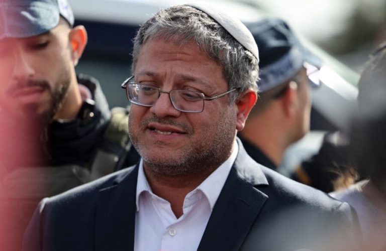 EDITORS NOTE: Graphic content / Israeli far-right minister Itamar Ben-Gvir speaks to the press at the scene of a shooting attack in the southern town of Kiryat Malakhi on February 16, 2024. A gunman killed two people on February 16 at a bus stop in southern Israel, authorities said, prompting Prime Minister Benjamin Netanyahu to warn the entire country was a frontline in the war. (Photo by AHMAD GHARABLI / AFP)