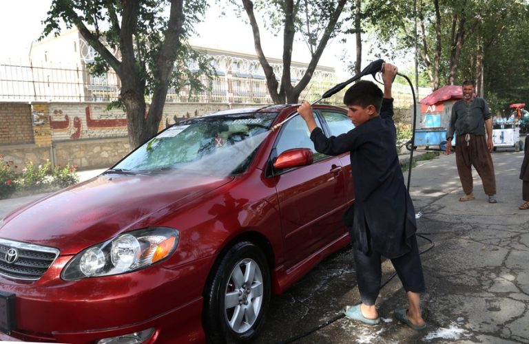 Children washing cars in Afghanistan