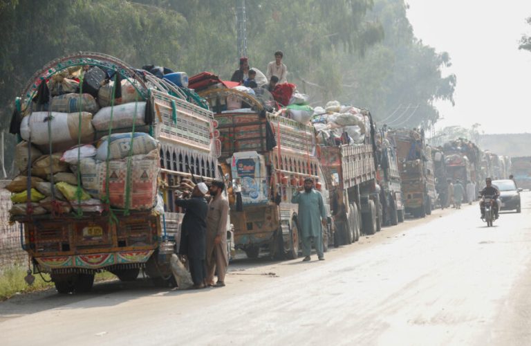 FILE PHOTO: Trucks loaded with belongings are seen as Afghan refugees are returning home, after Pakistan gives the last warning to undocumented immigrants to leave, outside the United Nations High Commissioner for Refugees (UNHCR) repatriation centres in Azakhel town in Nowshera, Pakistan October 30, 2023. REUTERS/Fayaz Aziz/File photo