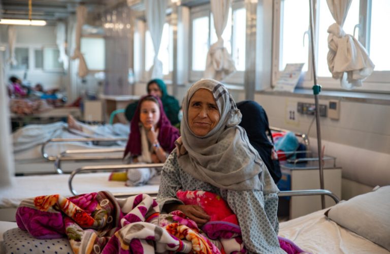 Marieh, who is a patient in the MSF Kunduz Trauma Centre in Afghanistan, poses for a picture in the hospital’s female inpatient ward. She was injured by her son who accidently shot her in the leg.