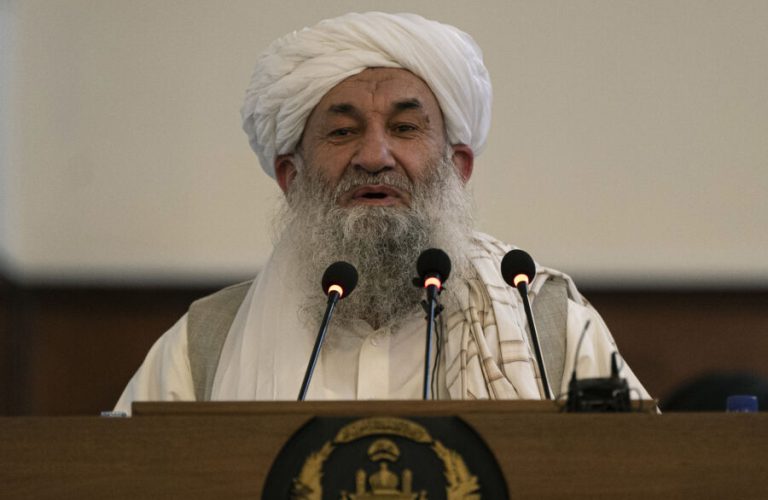 Afghanistan's Prime Minister Mohammad Hassan Akhund speaks during a gathering at the former presidential palace in Kabul on August 13, 2022. (Photo by Wakil KOHSAR / AFP)