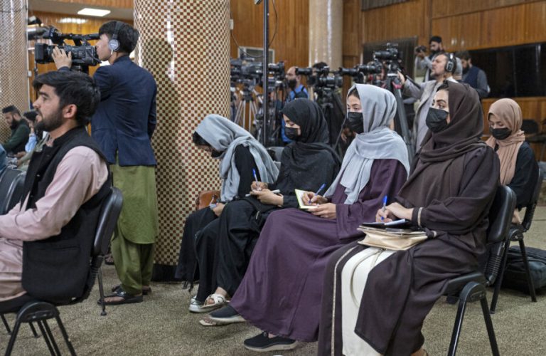 Afghan female journalists wearing facemasks, attend a press conference by Afghanistan's Minister of Foreign Affairs Amir Khan Muttaqi, in Kabul on September 19, 2024. (Photo by Wakil KOHSAR / AFP)