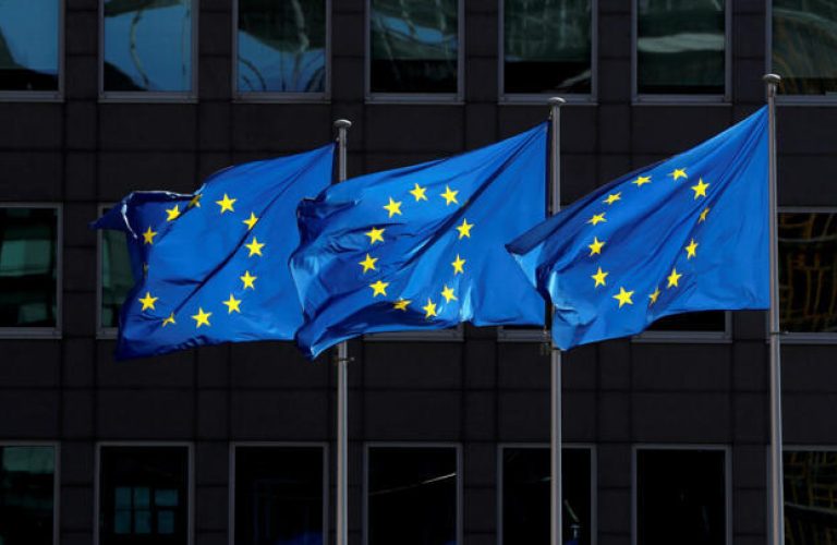 FILE PHOTO: European Union flags flutter outside the European Commission headquarters in Brussels, Belgium August 21, 2020. REUTERS/Yves Herman/File Photo