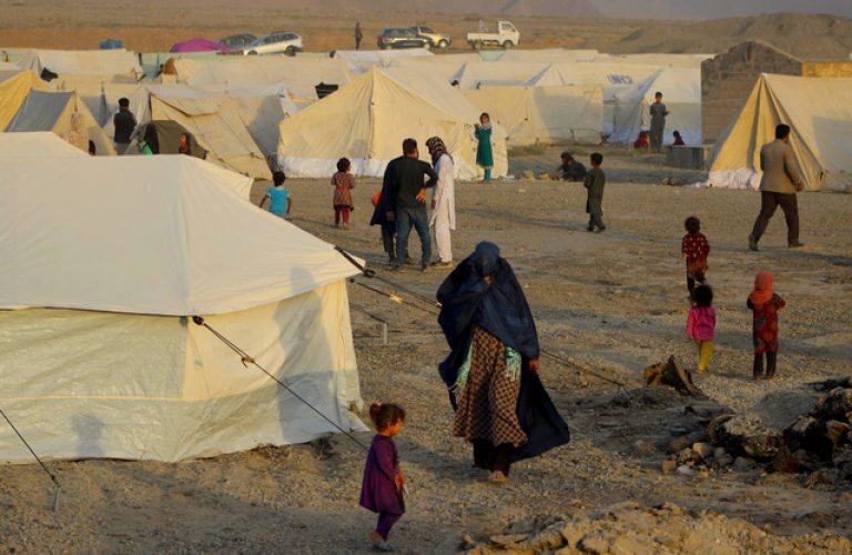 In this photograph taken on October 10, 2016, Afghans displaced by ongoing fighting against Taliban militants walk inside a makeshift camp in Takhar province.
The number of war-displaced civilians in Kunduz has more than doubled to 24,000, the UN said on October 9, as street battles persisted a week after the Taliban stormed into the northern Afghan city. Terrified residents facing a growing humanitarian crisis have been fleeing explosions and gunfights to neighbouring provinces of Balkh, Takhar, Baghlan and the capital Kabul. / AFP PHOTO / BASHIR KHAN SAFI