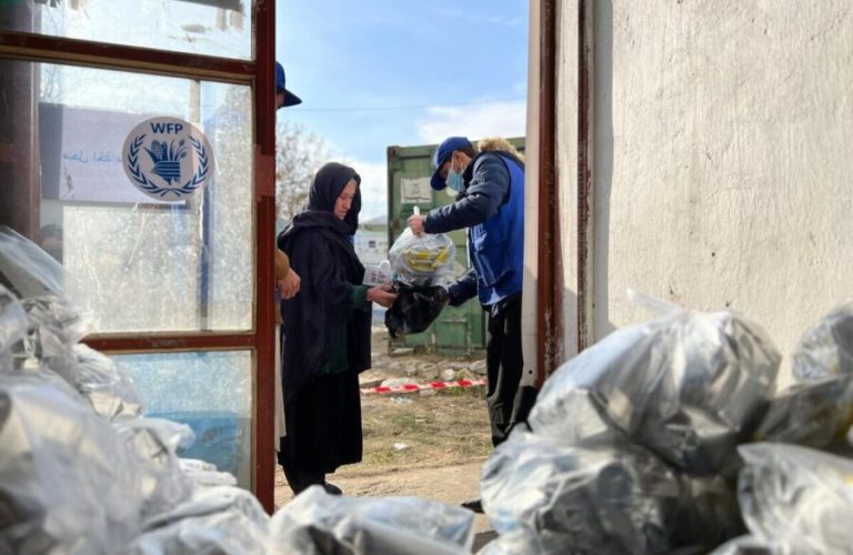 A woman receives specialized nutritious food at a distribution site in Salang District, Parwan Province, 50 kilometers north of Kabul, where 600 families were served that day. This distribution is part of the winter scale-up of WFP that will reach 6.2 million people across the country.