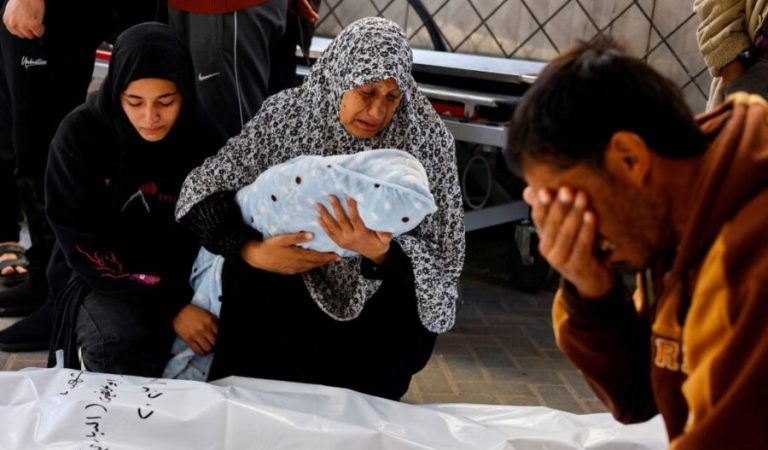 The grandmother of Palestinian baby Idres Al-Dbari, who was born during the war and killed in an Israeli strike in the ongoing conflict between Israel and the Palestinian Islamist group Hamas, reacts at Abu Yousef al-Najjar hospital in Rafah in the southern Gaza Strip December 12, 2023. REUTERS/Mohammed Salem