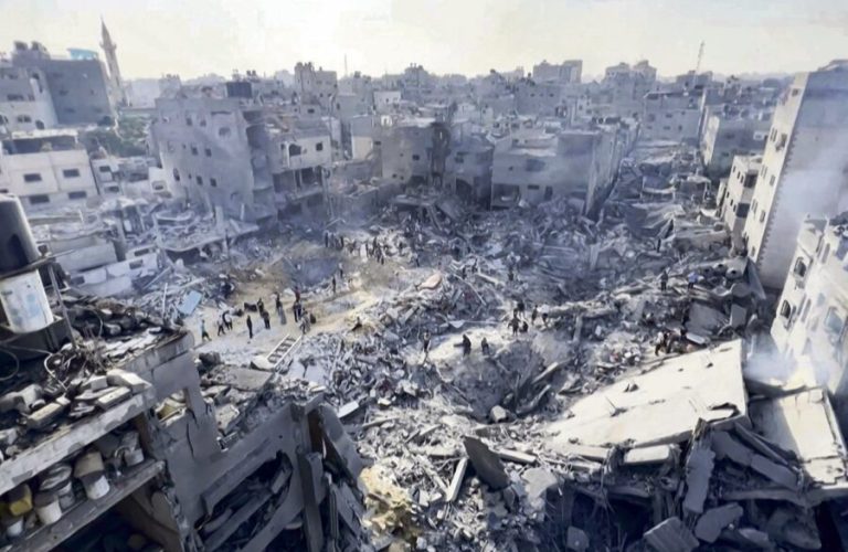 This image grab taken from AFPTV video footage shows Palestinians checking the destruction in the aftermath of an Israeli strike on the Jabalia refugee camp in the Gaza Strip, on November 1, 2023, amid ongoing battles between Israel and the Palestinian Hamas movement. Thousands of civilians, both Palestinians and Israelis, have died since October 7, 2023, after Palestinian Hamas militants based in the Gaza Strip entered southern Israel in an unprecedented attack triggering a war declared by Israel on Hamas with retaliatory bombings on Gaza. (Photo by AFP)