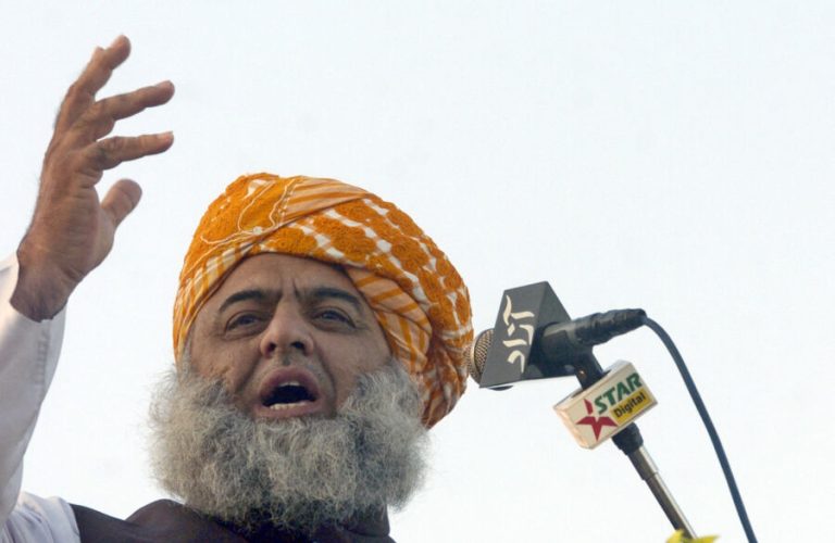 Leader of Pakistan's six-party religious alliance the Muttahida Majlis-e-Amal (MMA) Maulana Fazal-ur-Rehman addresses a rally in Karachi, 10 December 2006. Around 25,000 supporters of hardline Islamic parties staged a rally organised by the MMA in Karachi to protest against the passage of a bill that amends the country's Islamic rape laws. Pakistani parliament last month voted that rape and adultery cases should no longer be heard under the country's religious laws. The Islamic hardliners boycotted the proceedings.   AFP PHOTO/Asif HASSAN (Photo by ASIF HASSAN / AFP)