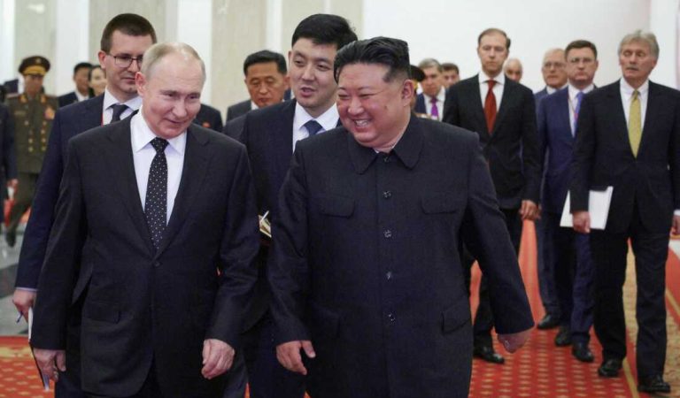 TOPSHOT - In this pool photograph distributed by the Russian state agency Sputnik, Russian President Vladimir Putin (L) and North Korea's leader Kim Jong Un (C) attend a Gala concert in Pyongyang, on June 19, 2024.  (Photo by Gavriil GRIGOROV / POOL / AFP) / -- Editor's note : this image is distributed by the Russian state owned agency Sputnik - (Photo by GAVRIIL GRIGOROV/POOL/AFP via Getty Images)